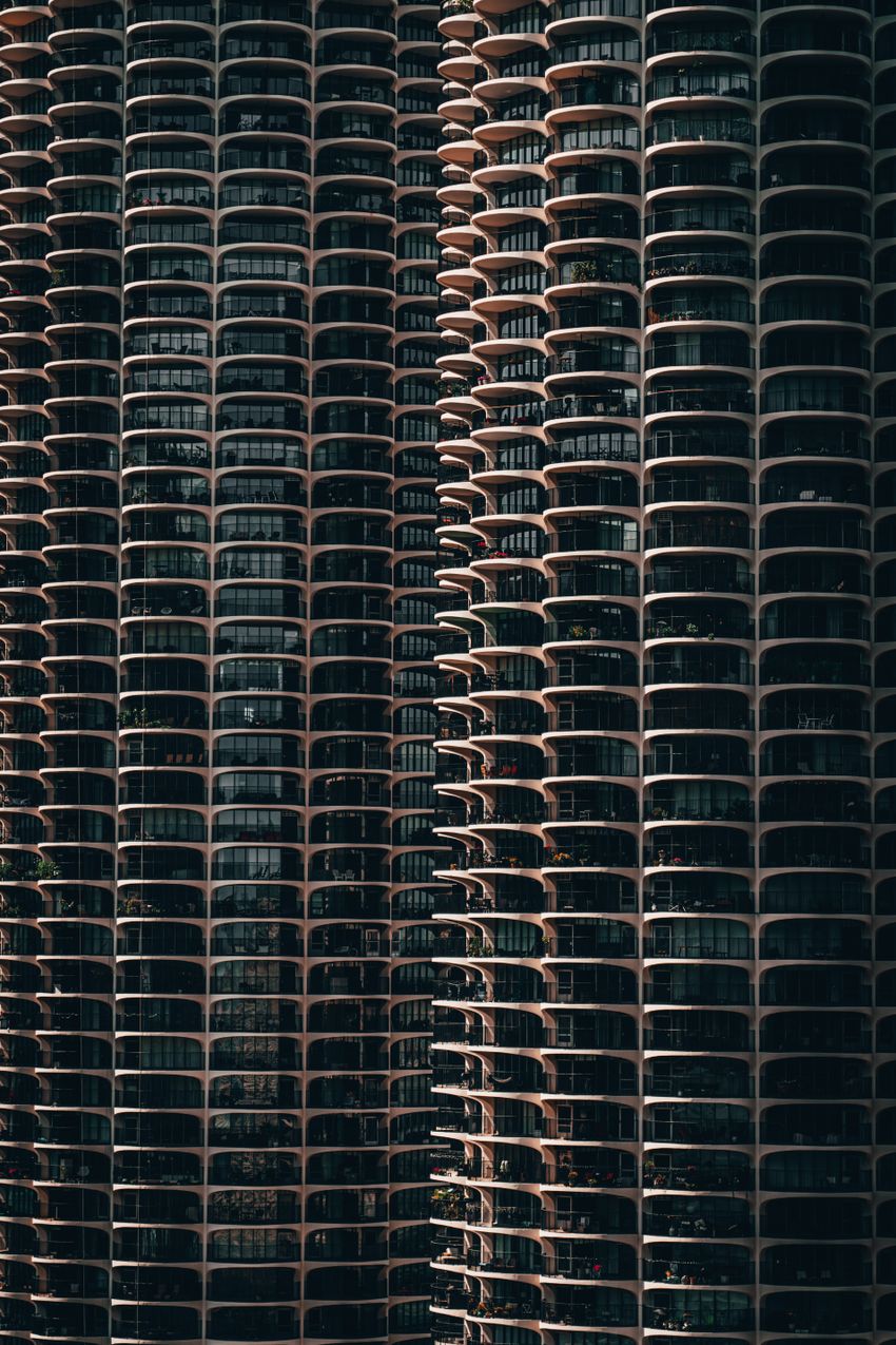 High-rise condo tower with multi-unit balconies — managed residential property